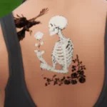 Skeleton with raven tattoo